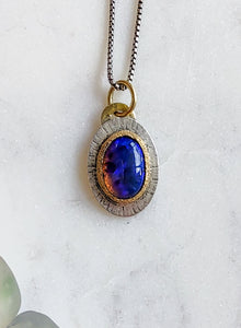 Black opal, gold, and silver pendant