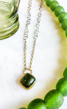 Green tourmaline, gold, and silver necklace